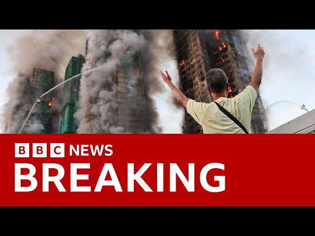 At least four killed as fire engulfs Hong Kong apartment blocks | BBC News